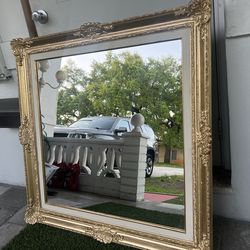 Nice gold mirror the frame is real wood