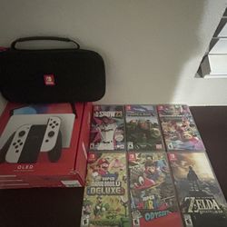 Mint  Nintendo Switch Oled w/travel case, joy-con protectors and 6 games. (read disc)