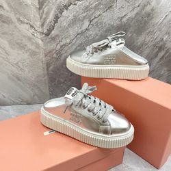 A pair of silver slippers
