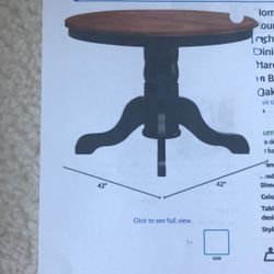 Dining table and two black leather chairs for table