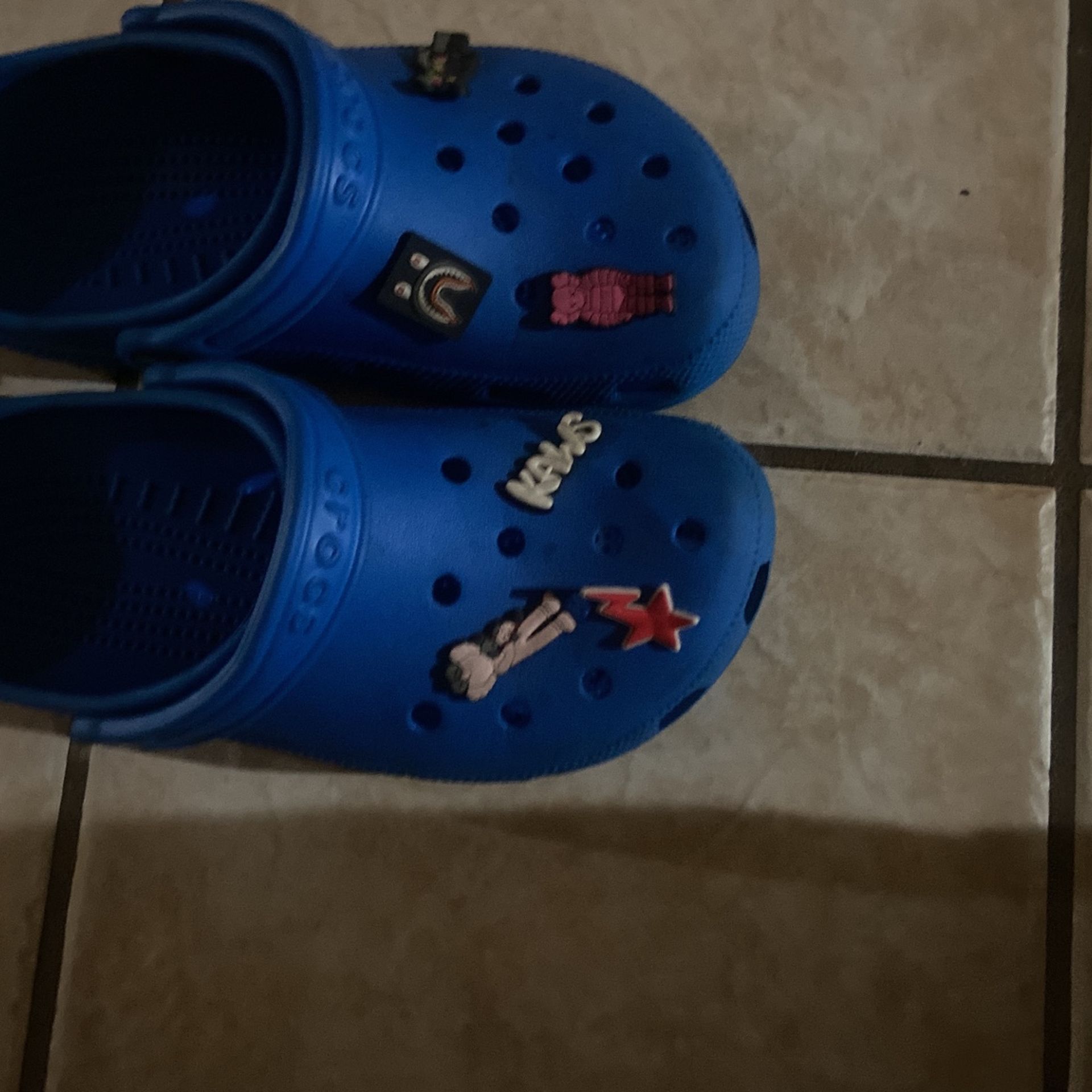 Royal blue crocs with charms