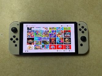 NINTENDO SWITCH OLED + 100 SWITCH GAMES