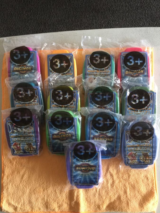 13 packs of Taco Bell Digimon Metal Cards with Cases never been opened.
