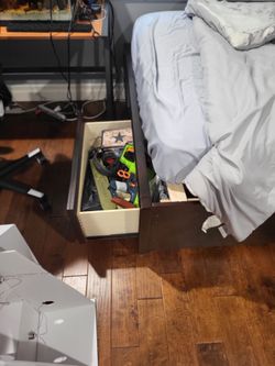 Full bed with drawers at foot and nightstand