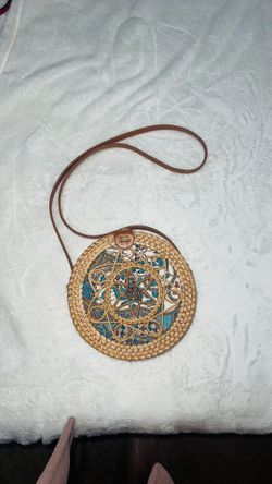Circular woven crossbody bag