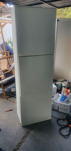 Two white cabinets