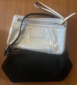 Black purse and clutch wristlet bag