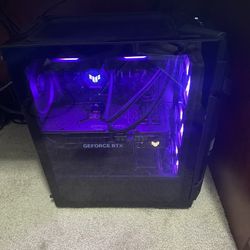 Gaming PC with dual monitors ergonomics stand and keyboard and mouse