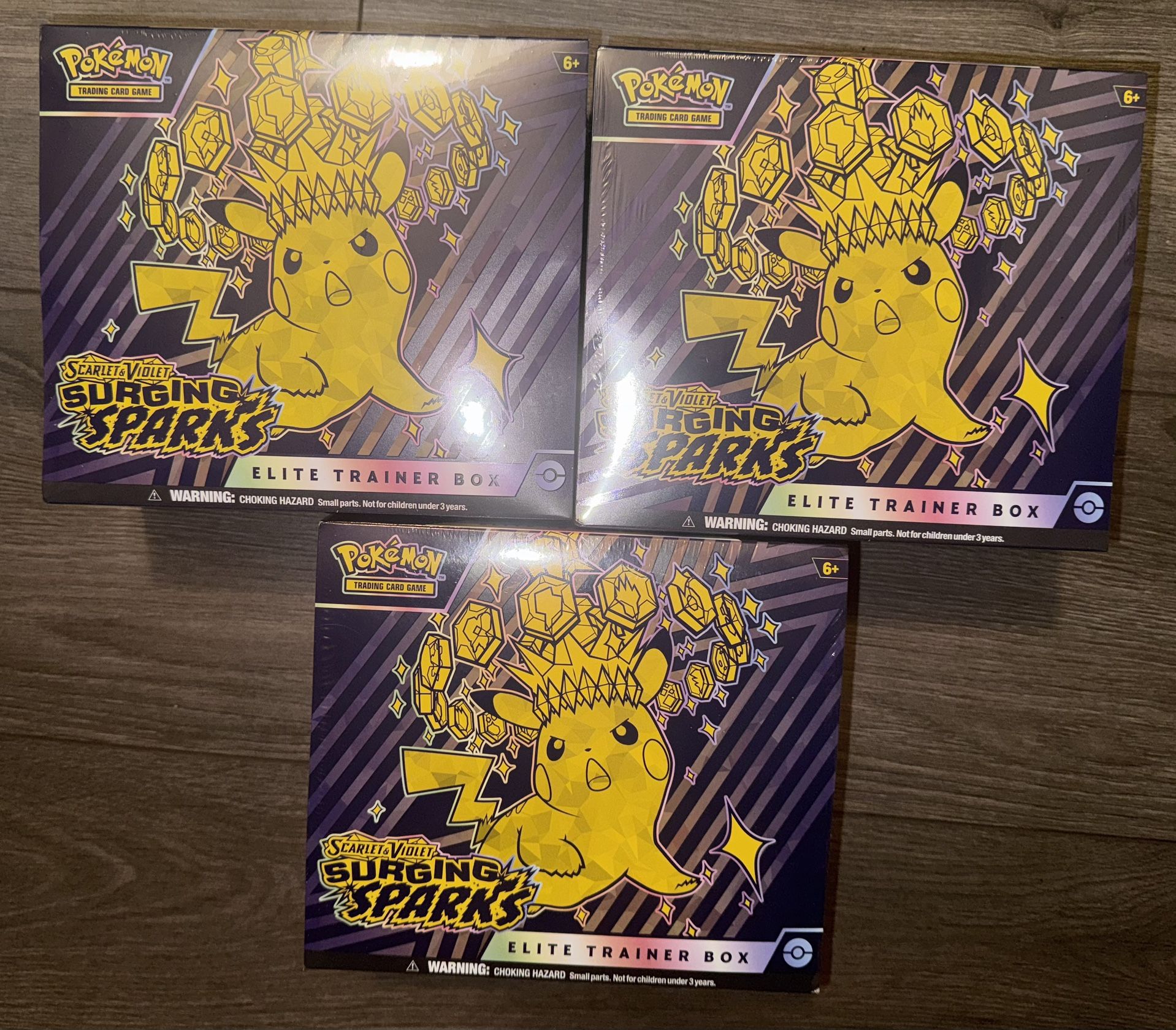Scarlet & Violet: Surging Sparks Elite Trainer Box – $80 each (4 available)
