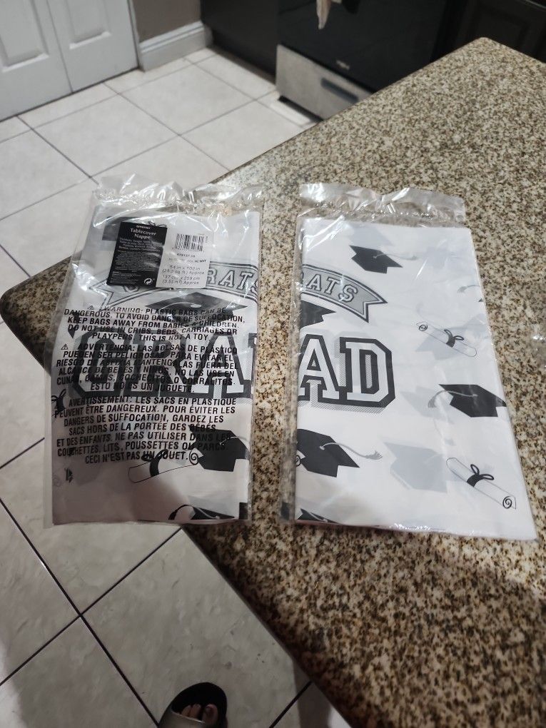 Brand New 2pks Of Plastic Graduation Tablecover Asking 5 For Both Brand New Package Not Open
