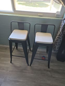 TWO BLACK METAL HIGH STOOLS