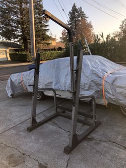 Nautilus squat rack with lat pull down.
