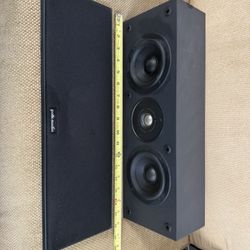 Polk Audio CS275 center channel speaker. Magnetically shielded center channel speaker designed for home theater systems. It is a 2-way, bass-reflex sp