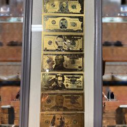Gold Foil  Of American Dollars In A Frame.