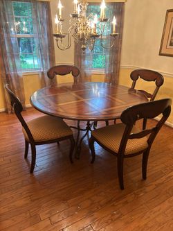 Dining Table and Chairs . Made by Millbridge. Hardwood with oak and cherry veneers and metal.