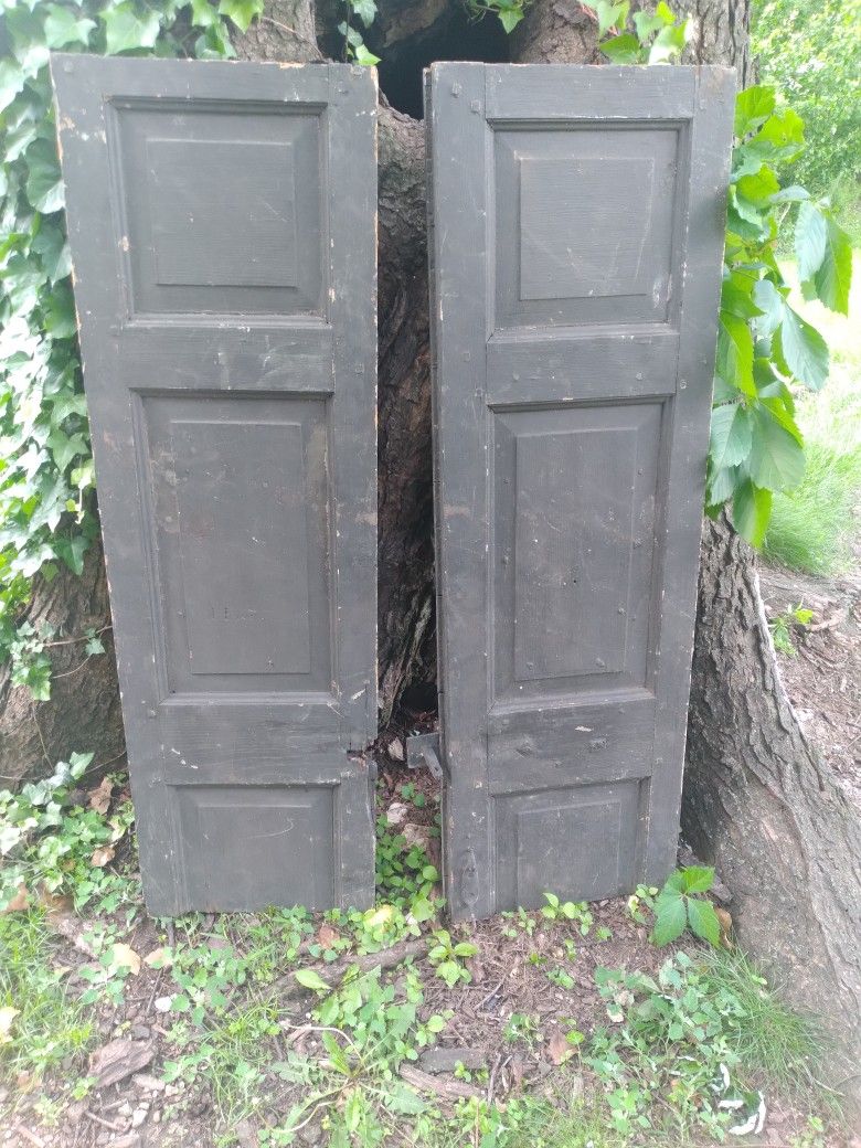 Pair of primitive hay barn shutters, with original hardware
