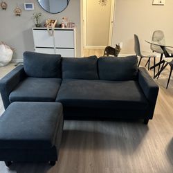 L Shaped Gray Couch With Small Chase For Feet 