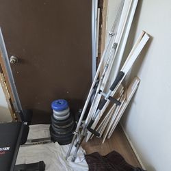 2 Bar Bells And Weights 20$