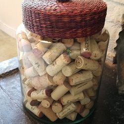 Decorative glass jar with woven lid
