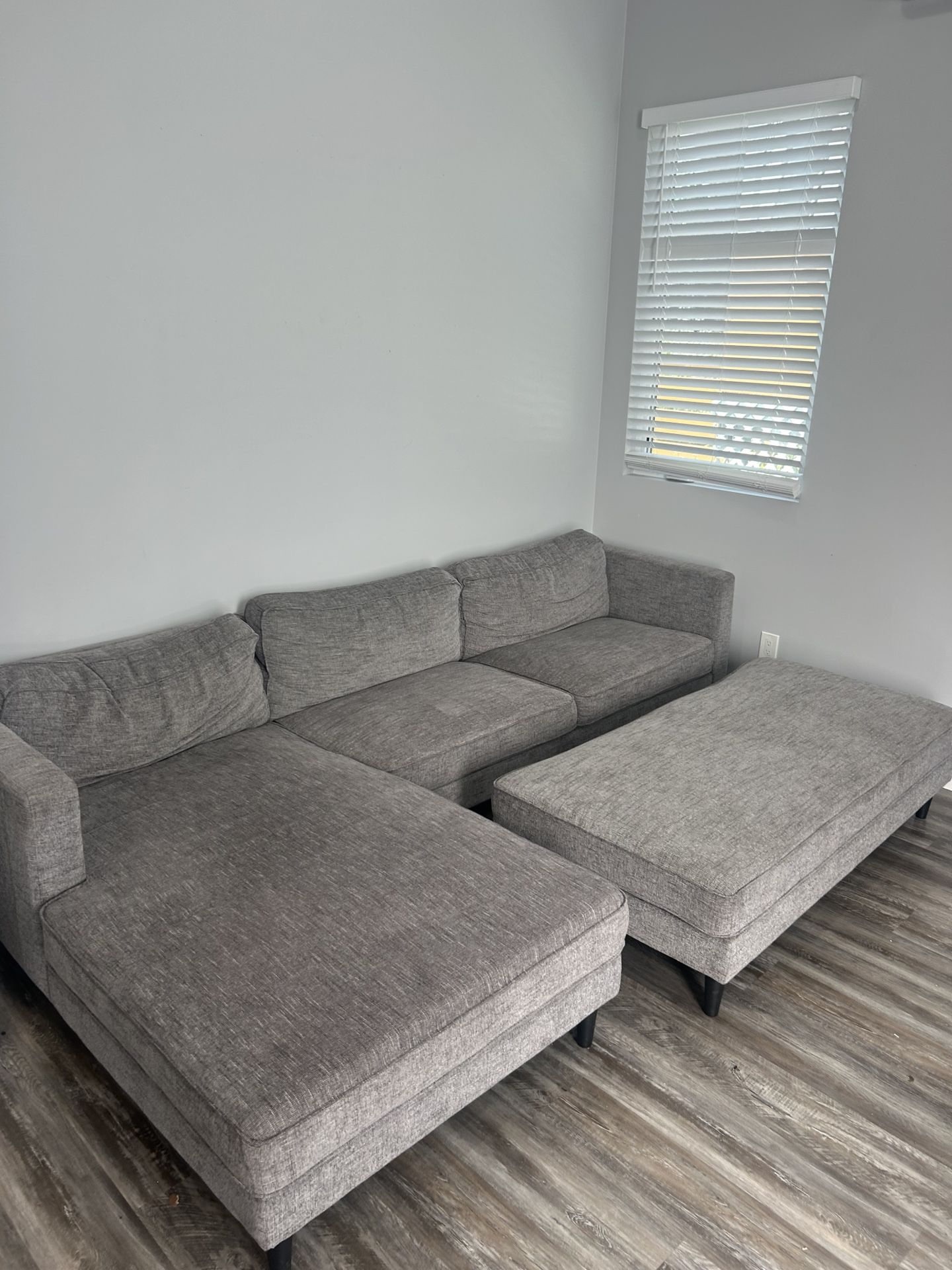 Grey “L Shape” Living Room Couch With Attachment