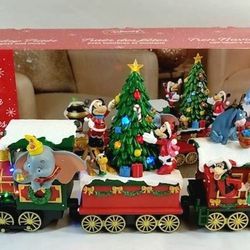 Disney Mickey Holiday Train with Lights and Music IOB. FIRM PRICE

Features:

Plays (8) classic holiday songs

Decorated with Disney characters

Inclu