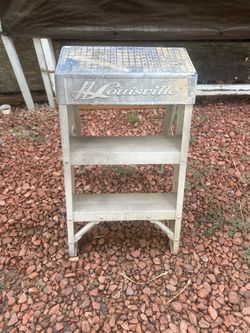 Heavy-duty Louisville 4-foot aluminum step ladder in good used condition. Lightweight, sturdy, and perfect for painting, electrical work, home mainten