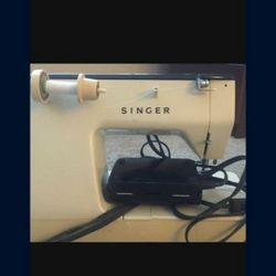 Sowing Machine Singer,  It Folds In To The Cabinet, Has A Pedal For Sowing, Comes With All The Exesories Very Unic.