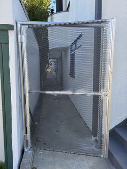 Door with expanded metal and galvanized tube