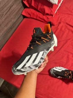 UM Football Cleats size 10.5
