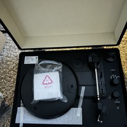 Record player with built-in speakers and Bluetooth.