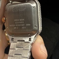 Cartier stainless steel with VVS moissanite and 14K rose gold.