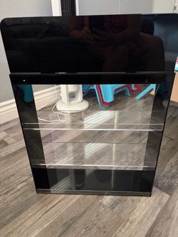 Black display cabinet with clear acrylic shelves. Good for collectibles, figures, or retail display.   $40 each or all 3 for $90.00.  All new