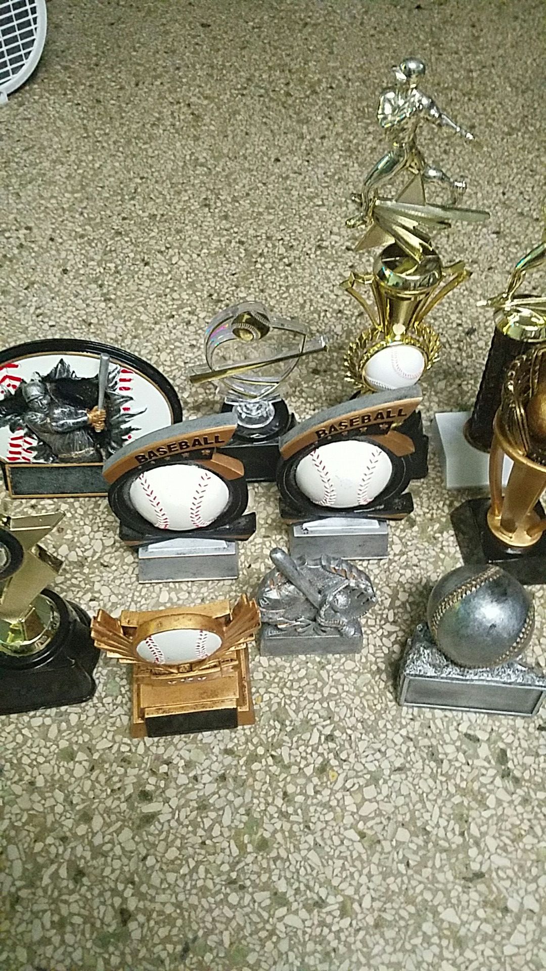 11 baseball trophies