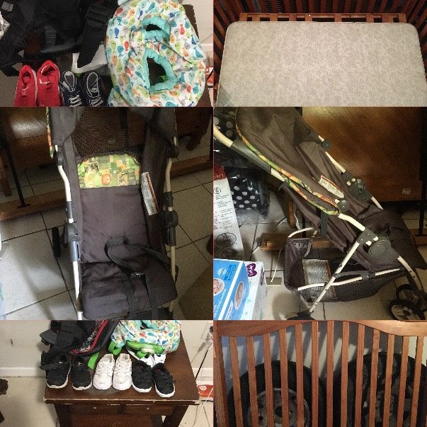 Baby boy clothes, shoes, a stroller and a crib