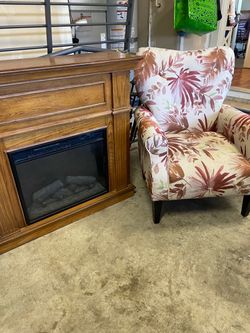 Electric small fireplace and armchair