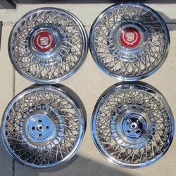 1986 to 1988 Cadillac 14" Wire Spoke Hubcaps/ WheelCovers. OEM by GM