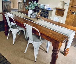 Farmhouse Table With Distressed Modern Metal Chairs