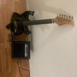 Electric Guitar With Amplifier And Cable  