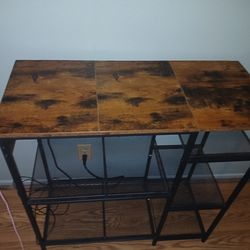 Side table, entry way shelf with storage and 5 power source and a plug that's attached for electricity for lamps, charge phone etc. Brand new still.