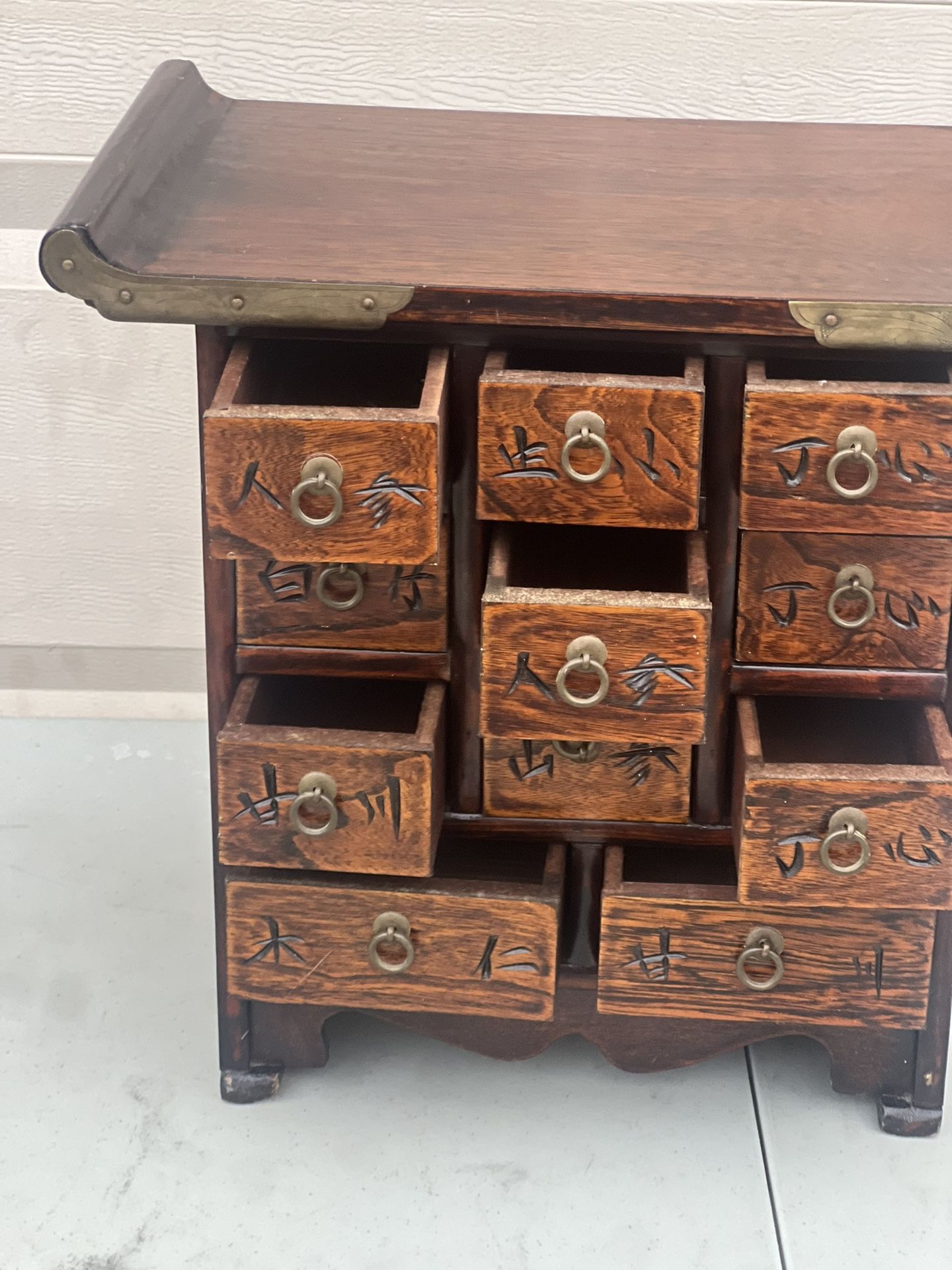 Asian Korea Wooden Brass Eleven Drawer Apothecary Chest/ Jewelry Trinket Box. Used in good condition with minor cosmetic blemishes. These blemishes ar