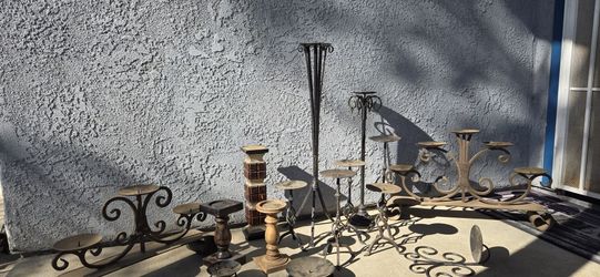 15 wrought, iron candlesticks, and 3 wood.
Bundle only