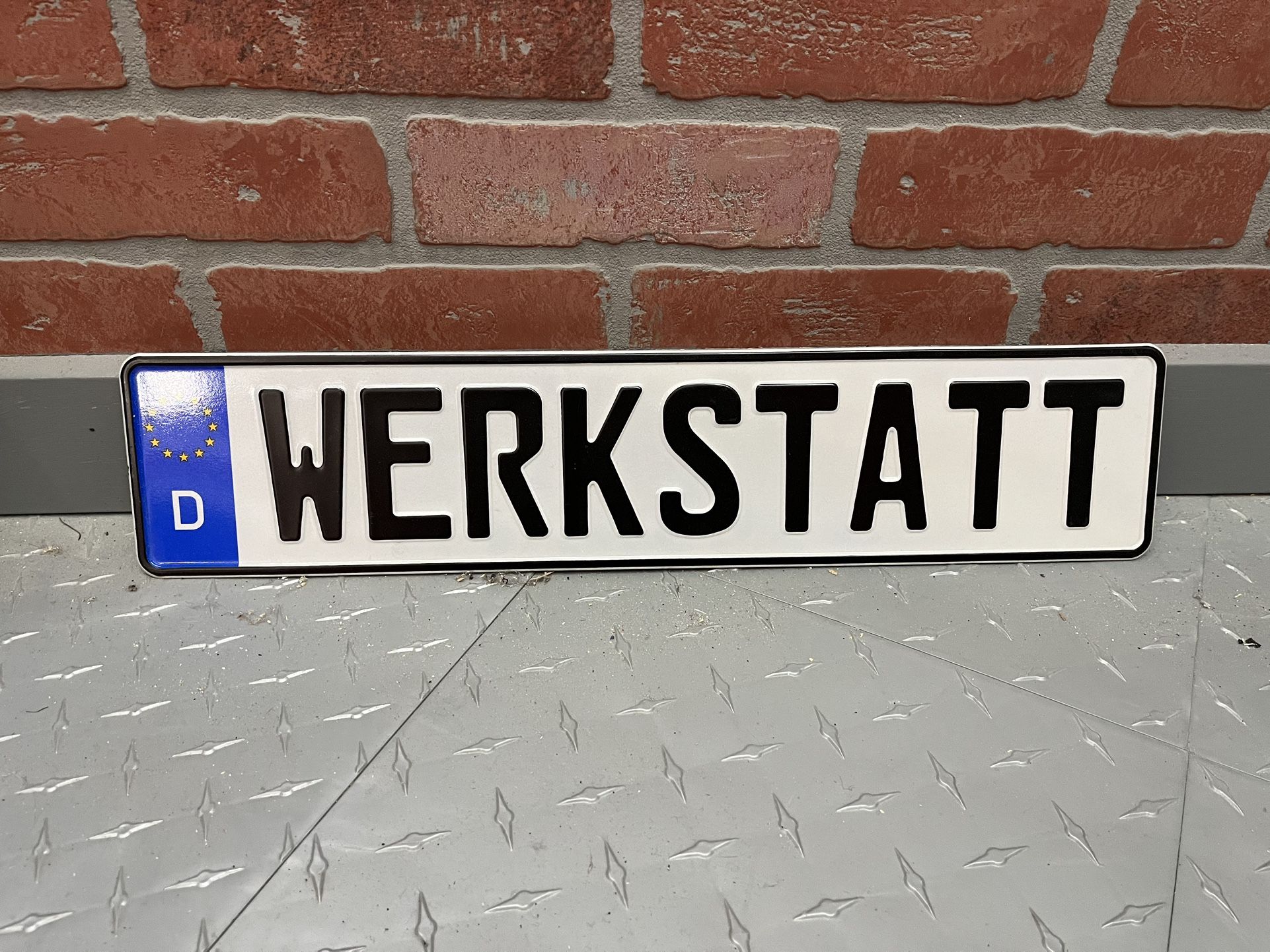 European License Plate 520mm X 110mm. Says Workshop In German. Volkswagen Audi Mercedes BMW
