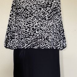 Evening Two Toned Black N White Cocktail Dress Knee Length , three quarter Sleeve With Slits From Shoulder To Elbow. Brand Is Nicole Miller