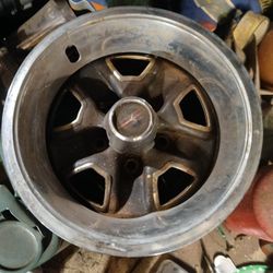 Fourteen inch oldsmobile rallies With center caps and two beauty rings