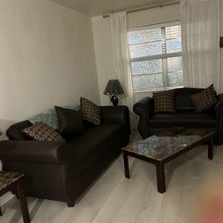 Sofa And Loveseat ,2 End Tables.  Coffee Table And Cushion Came With It.