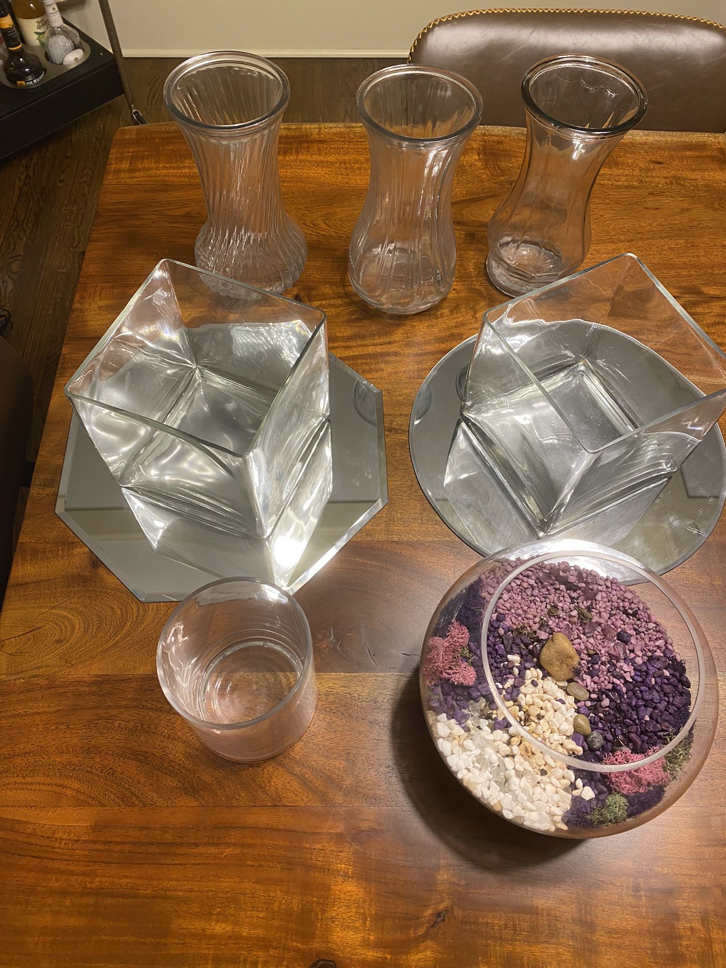 Variety of glass flower vases and plant terrarium 9 items total. 3 round tall vases + 2 short square vases with the 2 mirrors underneath + 1 plant ter