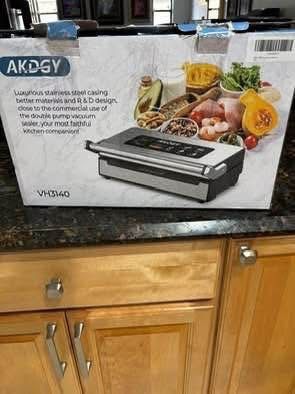 New Stainless Steel Vacuum Sealer by AKDGY. Double heat for dry, moist, and liquid. various modes. easy lock handle 