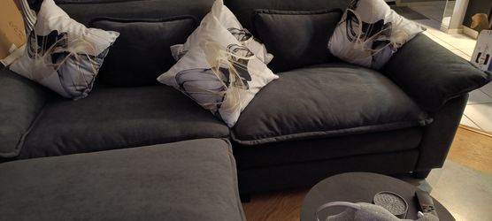 Two slightly used Dark Grey couches