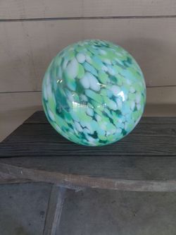 Battery operated, solar charging glass balls