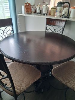 Dark Oak top and metal  frame bottom.